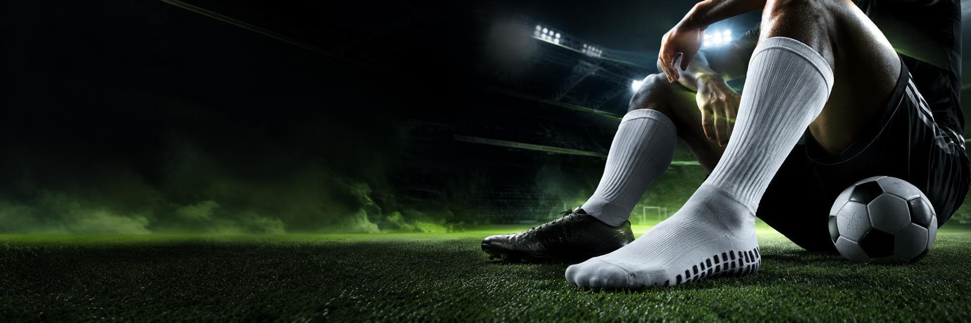 Football player wearing performance grip socks