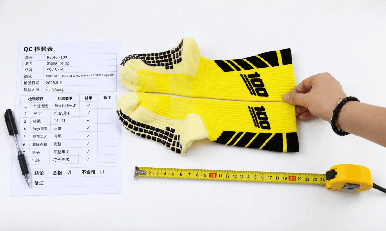 Football sock sample laid flat beside a quality checklist and tape measure