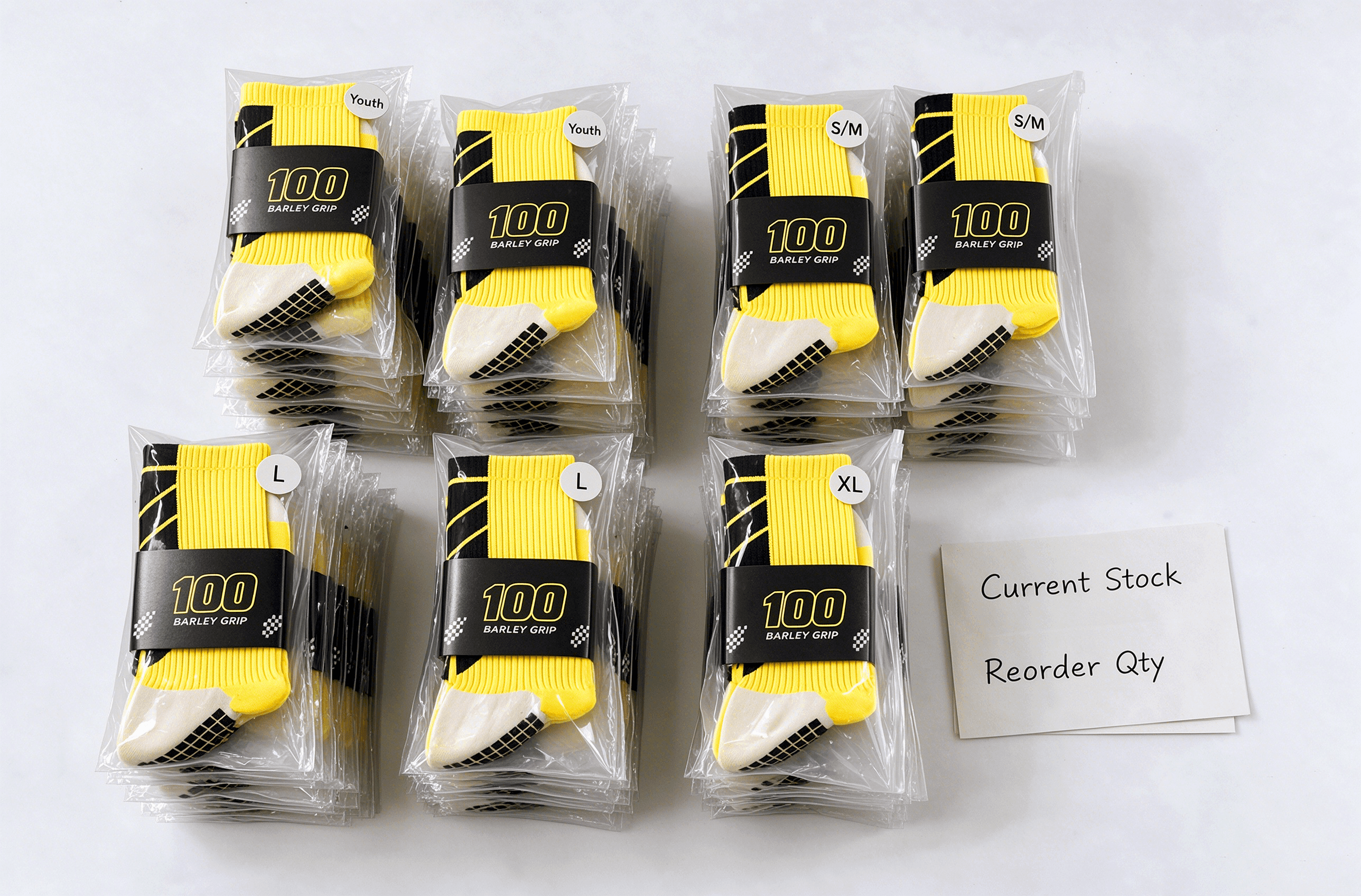 Football socks separated by size with current stock and reorder quantity notes