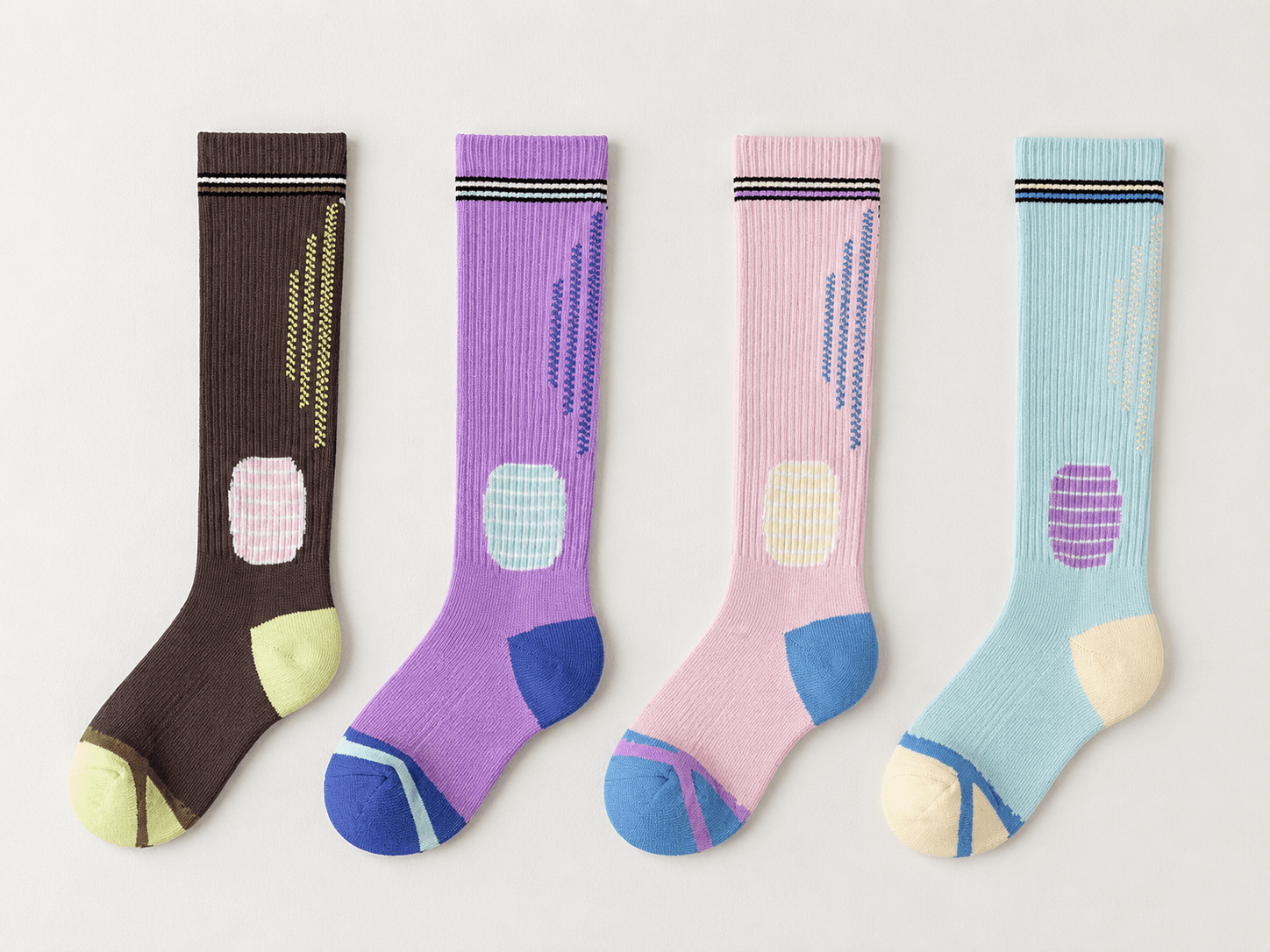 Four custom marathon event socks in coordinated race colorways