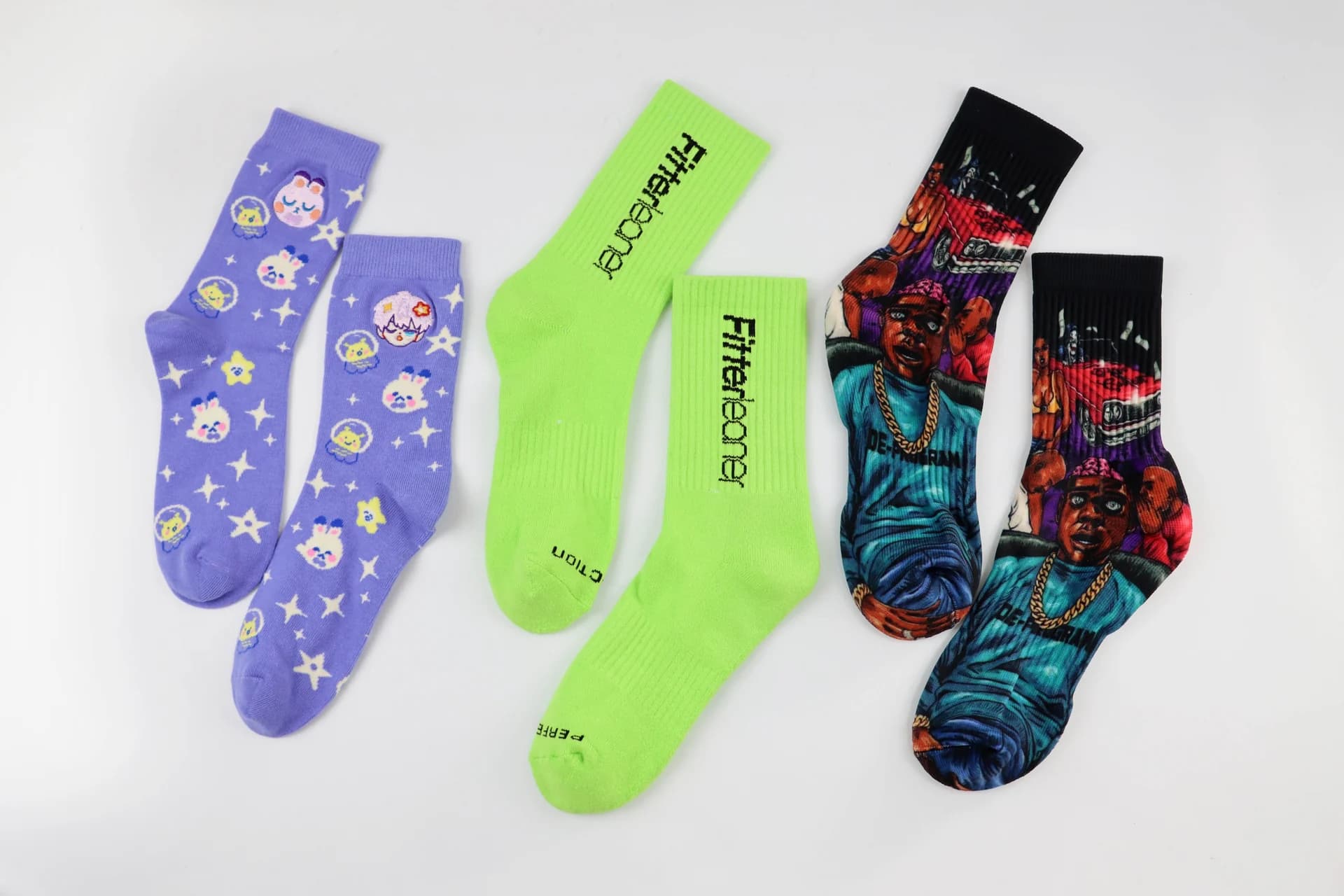 Custom sock collection showing illustrated, knitted and bright color design options