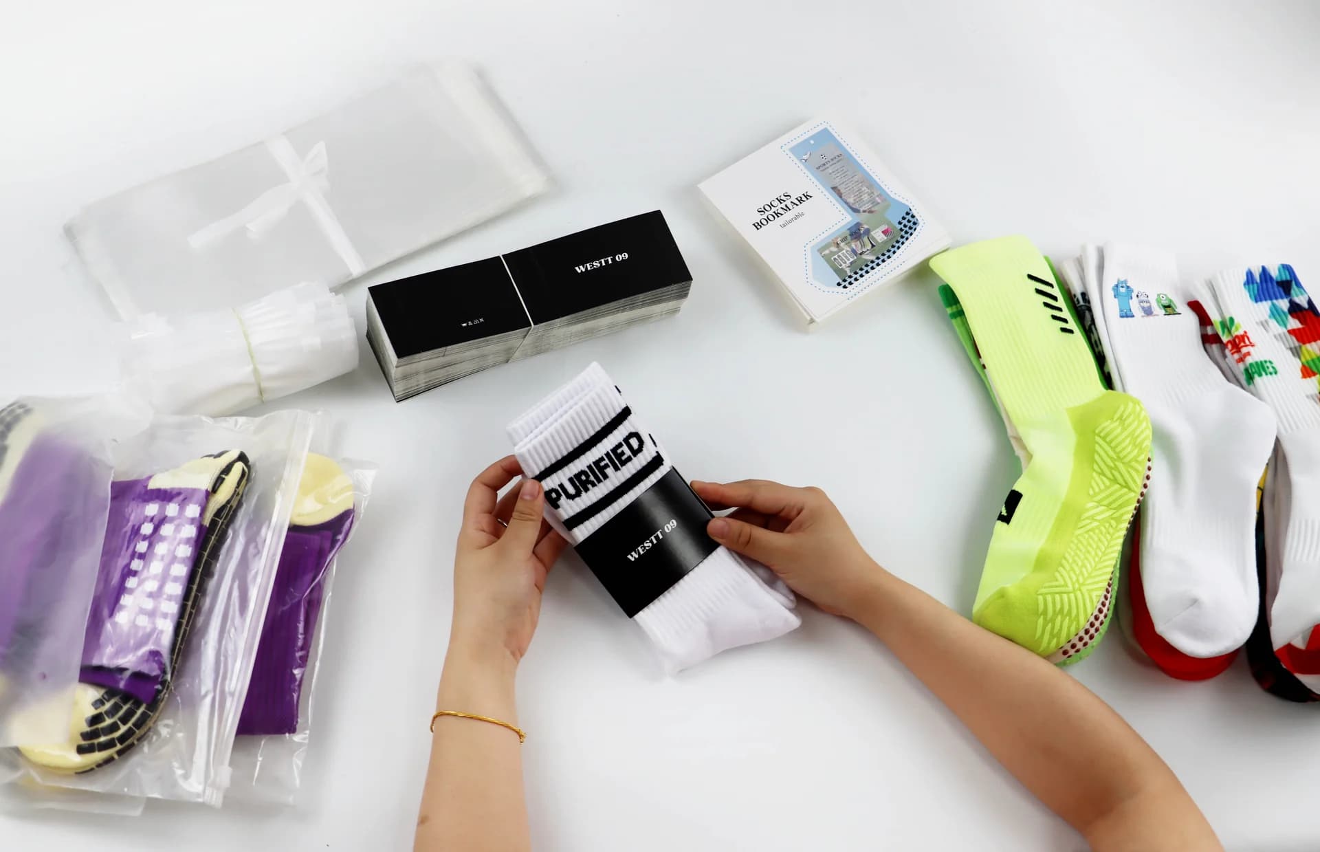 Private label sock packaging preparation with bands, bags and printed cards