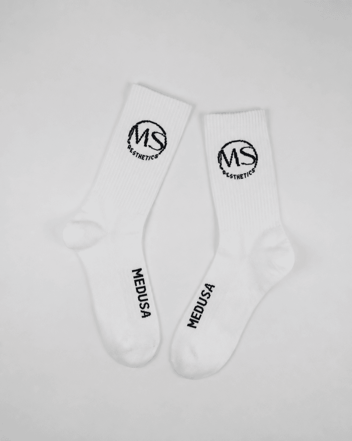 Finished white private label socks showing the customer logo