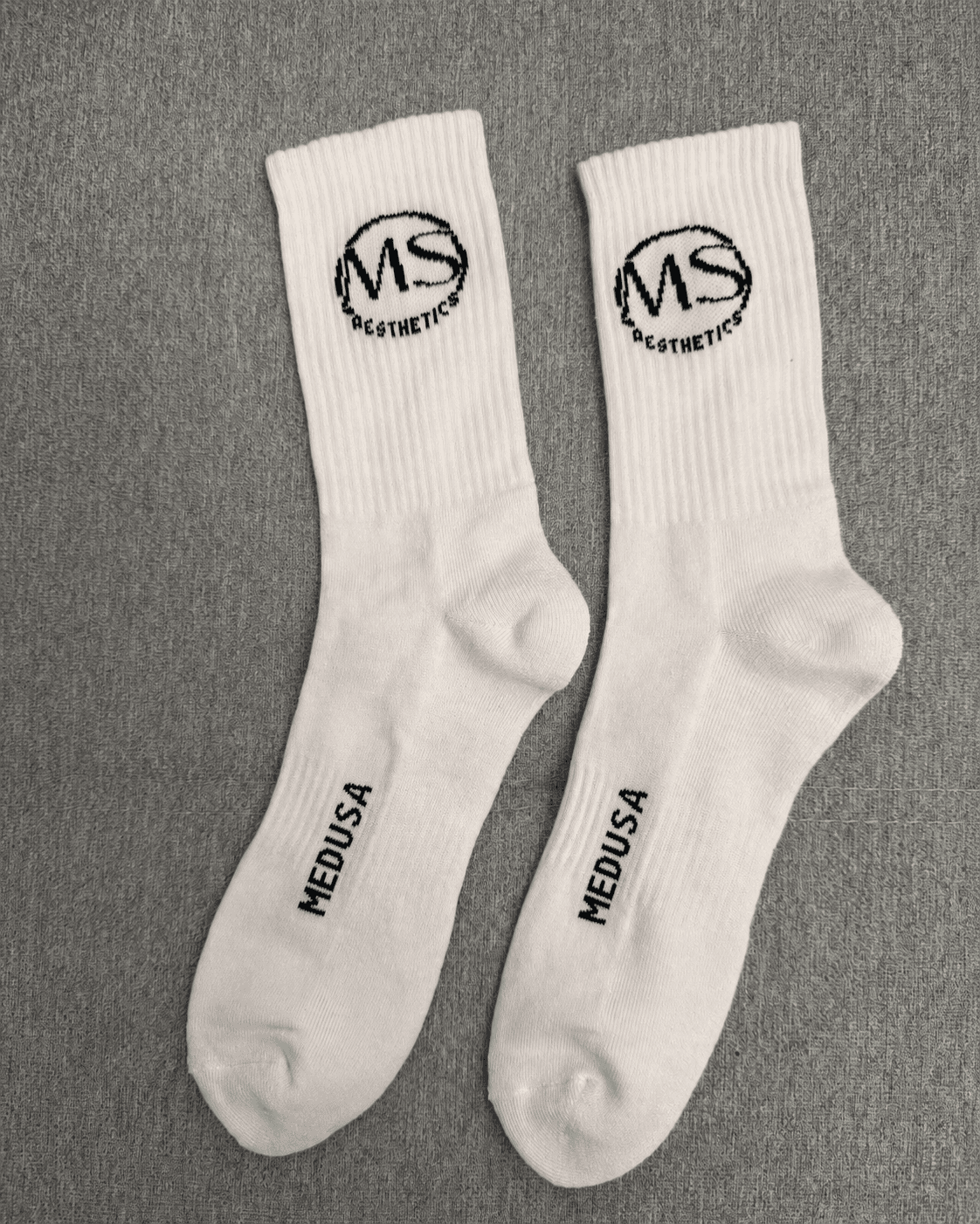 Physical private label sock sample used for fit and logo review
