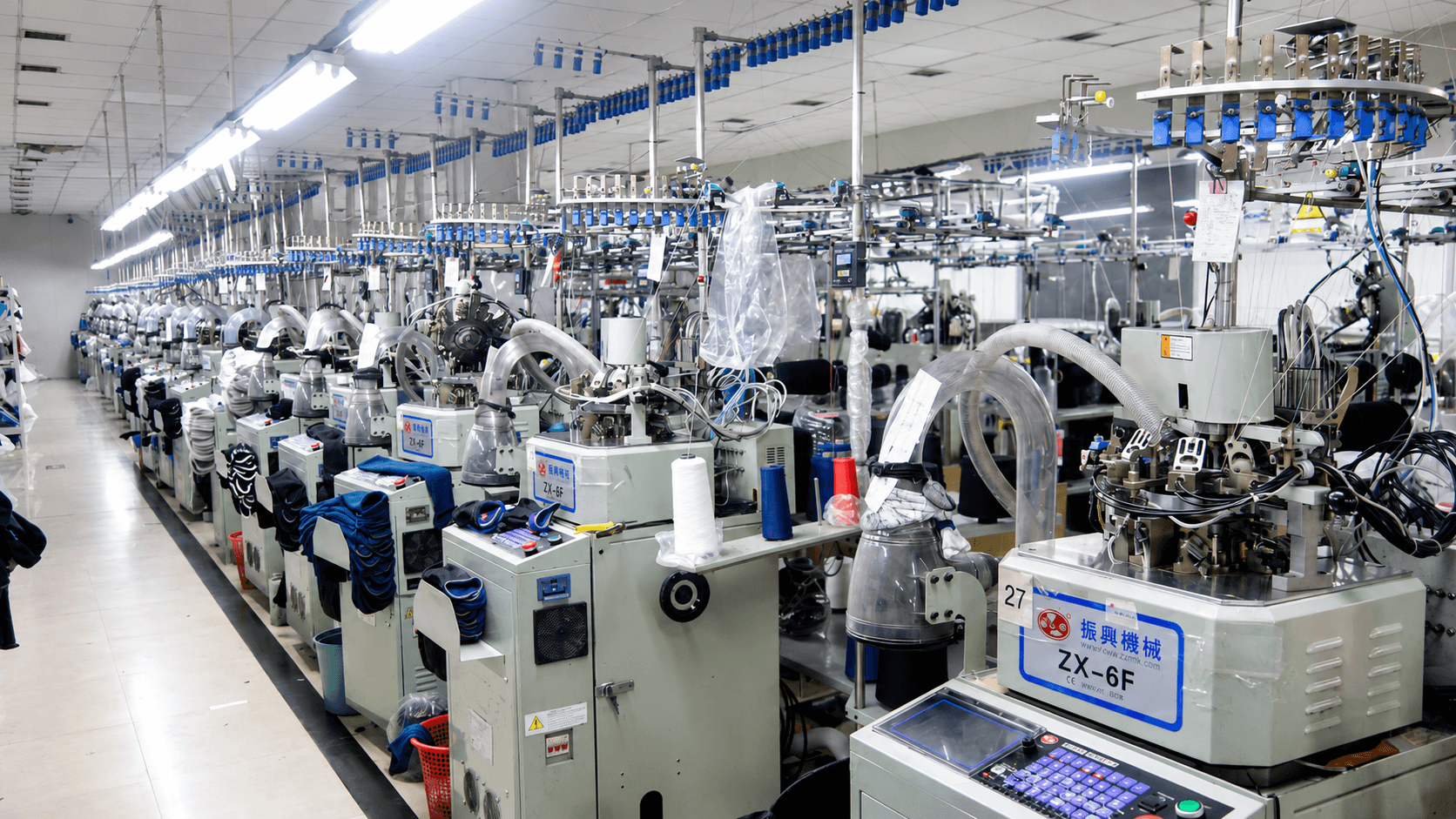 Computerized sock knitting machines on the PeakMotion production floor