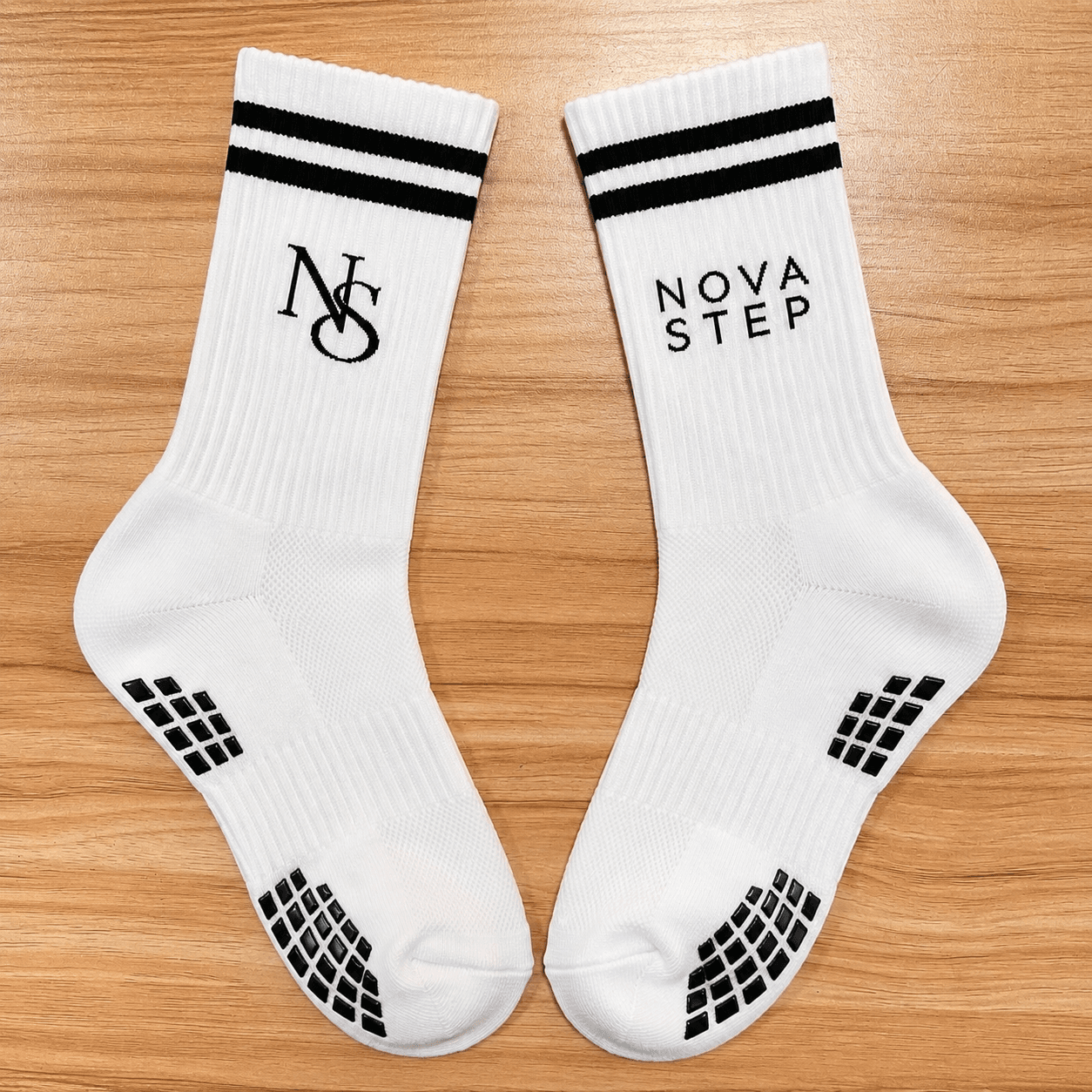 White Nova Step grip sock testing sample showing logo and silicone grip zones