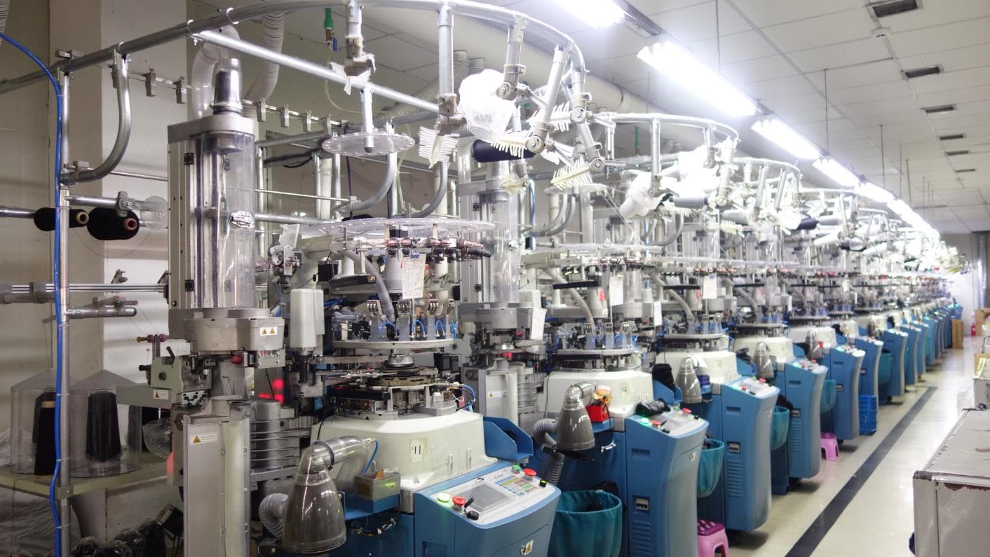 Production line of computerized machines for custom socks
